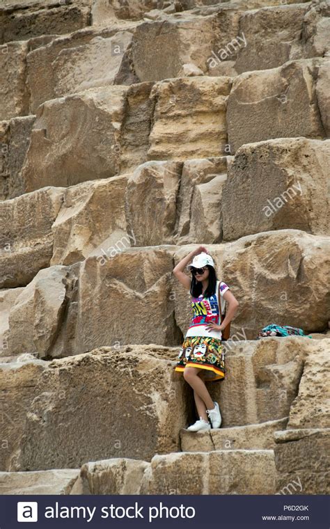 Asian Girl Tourist Poses For Photos In Front Of The Great Pyramid Of