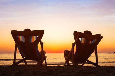 Happy Couple Relaxing In Beach Hotel At Sunset Honeymoon Stock Photo