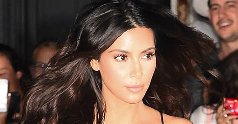 Kim Kardashian Goes Braless In Sheer Metallic Dress In Nyc