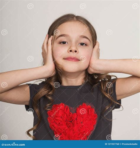 Stubborn Little Girl Blocking Her Ears With Hands Stock Photo Image