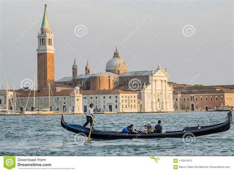 Tourists On A Gondola Venice San Giorgio Maggiore Island Venice