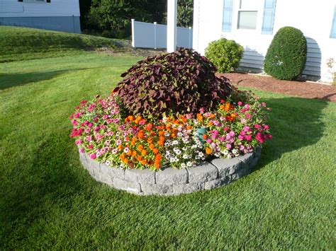 Flags and poles to suit most every need. Flagpole flowers (With images) | Flag pole landscaping ...