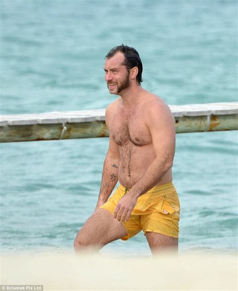 Jude Law Shows Off Paunchy Physique And Strange Facial Hair As He Takes A Dip In St Tropez