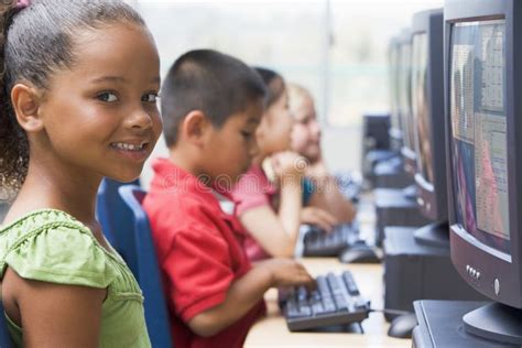 Kindergarten Children Learning To Use Computers Stock Photos Image