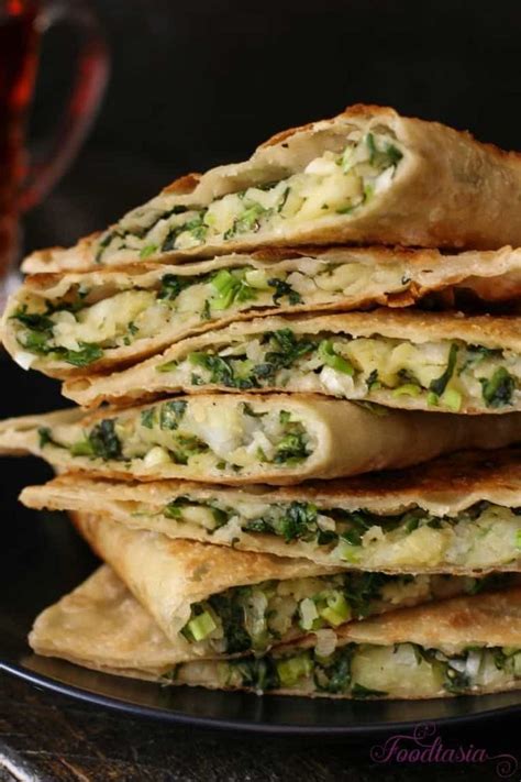 Stir za'atar and 3/4 teaspoon salt together in a small bowl and sprinkle evenly over the flatbread. Afghani Bolani - Potato, Green Onion, and Cilantro Stuffed Flatbread | Foodtasia | Recipe in ...