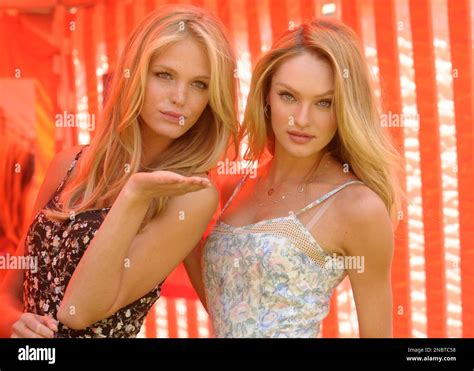Model Erin Heatherton Left And Model Candice Swanepoel Pose Together