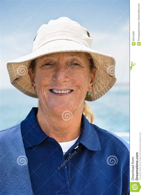 Portrait Of Smiling Woman Wearing Hat On Yacht Stock Photo Image Of
