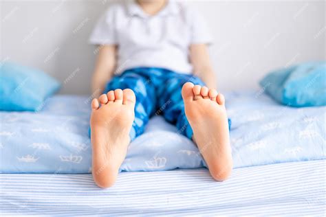 Premium Photo Legs Of A Small Childs Feet In Closeup The Child Is