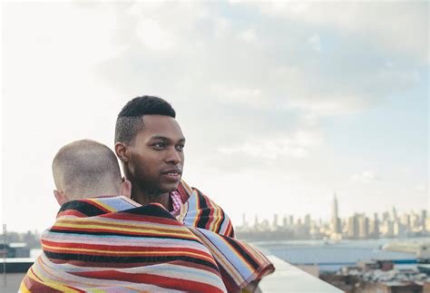 Ver Portrait Of Loving Interracial Gay Male Couple Embracing On A Brooklyn Rooftop Del