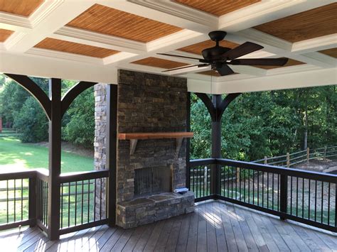 This Open Porch With An Integrated Stone Wood Burning Fireplace By