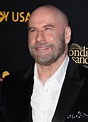 John Travolta debuts new shaved head