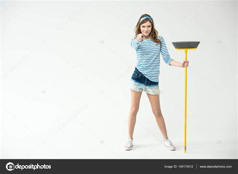 Young Woman With Broom — Stock Photo © Igortishenko 140174012