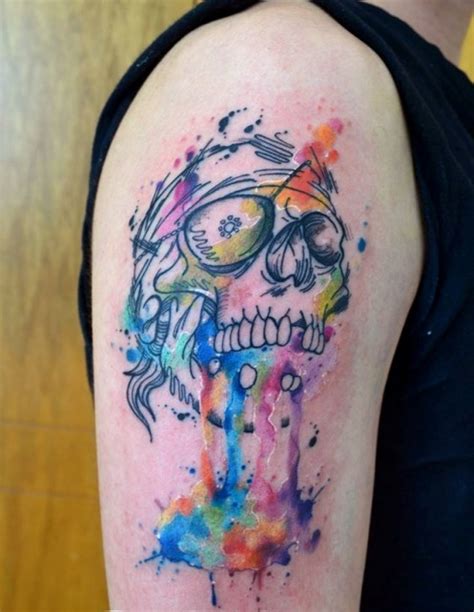 Cool Watercolor Skull Tattoo On Biceps Tattoo Ideas