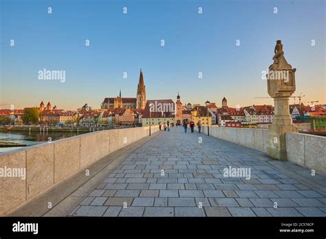 Stone Bridge Towards Regensburg Cathedral In The Old Town In The