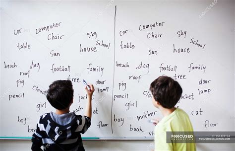 Boys Writing On Whiteboard — School Building Horisont Stock Photo
