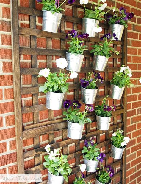 Diy wall garden with moveable planters. DIY Vertical Wall Planter via Cape 27 | Vertical herb ...