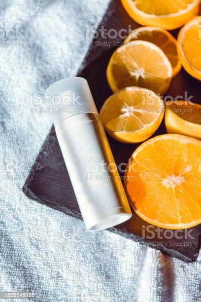 Oranges And Skincare Moisturizer Part Of Healthy Daily Routine Stock