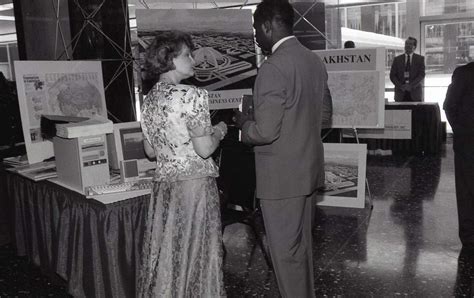 A MAN AND WOMAN HAVING A CONVERSATION AT THE WORKSHOP NARA DVIDS