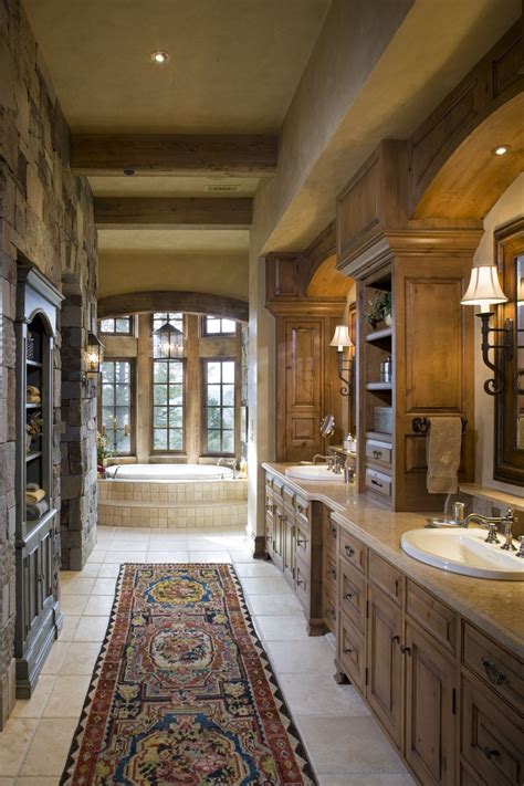 Start with a master bedroom or the one that is farthest from the bathroom. Master bath. Stone wall. Wood Beam ceiling. Wall-mounted ...