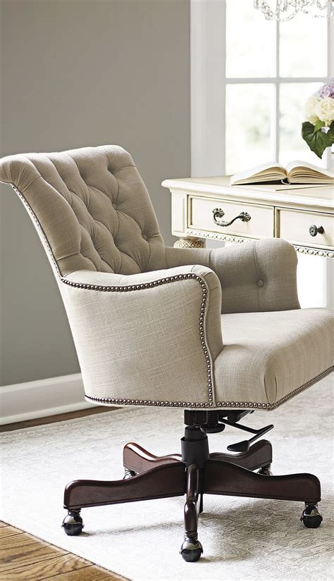 Maybe you would like to learn more about one of these? Button-tufted linen accented with silver nailhead trim ...