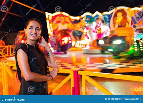 Young Beautiful Woman Having Fun In The Amusement Park Concept Of Entertainment And Summer