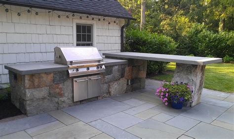 Typically, you will have a choice of stucco or stone veneer and tile or granite countertops. Outdoor Kitchen by Cording Landscape Design l shape with ...