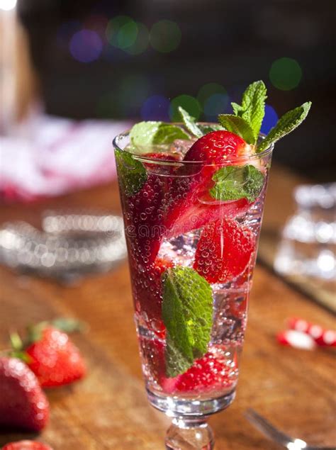 Summer Cold Drink With Strawberries Mint And Ice On Wooden Bar Counter