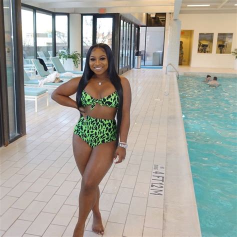 Lil Wayne S Daughter Reginae Carter Wows Poolside In Green Cheetah Bikini