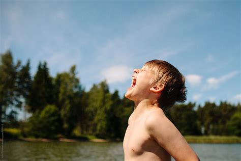 Tween Boy Shouting While Swimming In The Finnish Archipelago By