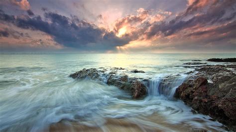 2560x1440 Beach Sea Dawn Dusk Landscape Ocean Rocks Sunlight 1440p