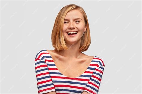 Free Photo Positive Woman With Broad Smile Shows White Teeth Laughs At Good Joke Likes