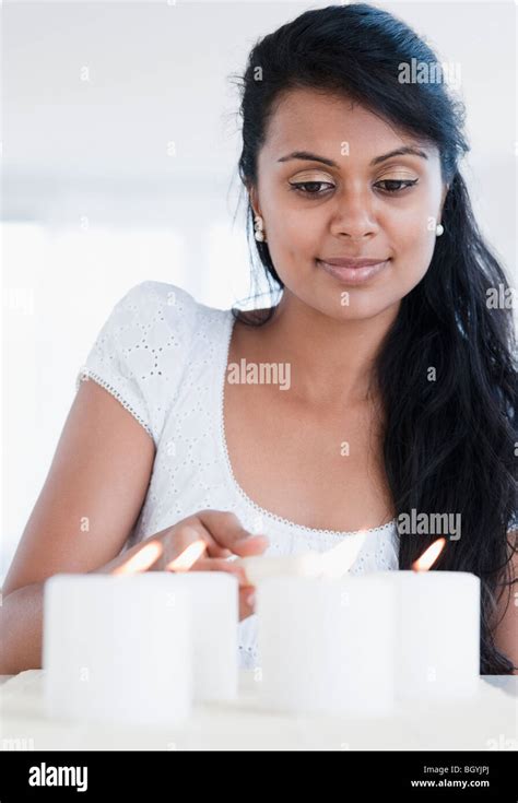 Mid Adult Woman Lighting Candle Hi Res Stock Photography And Images Alamy