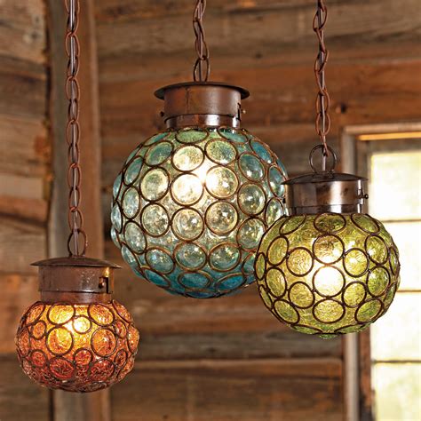 A new pendant shade can freshen that fixture over the kitchen island. Southwest Glass Sphere Pendant Lights