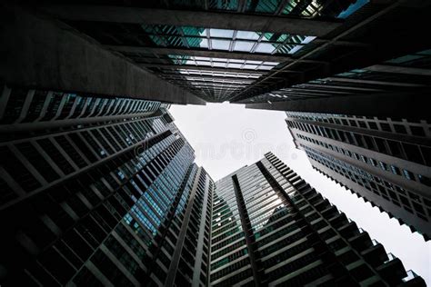 Low Angle Shot Of Modern Glass City Buildings With Clear Sky Background