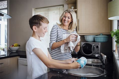 Mother And Son Doing The Dishes The Center For Communities That Care