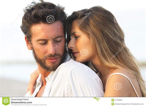 Woman Embracing Her Man From Behind On Seaside Background Stock Photo - Image of lagoon, lovers ...