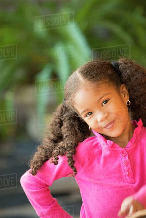 Portrait Of Smiling Mixed Race Girl Stock Photo Dissolve