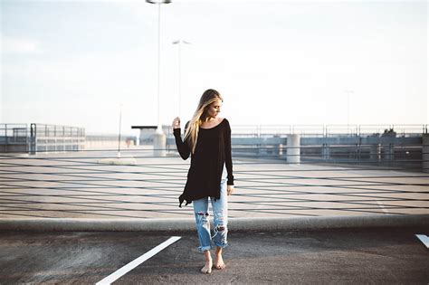 woman standing on gray concrete pavement hd wallpaper peakpx