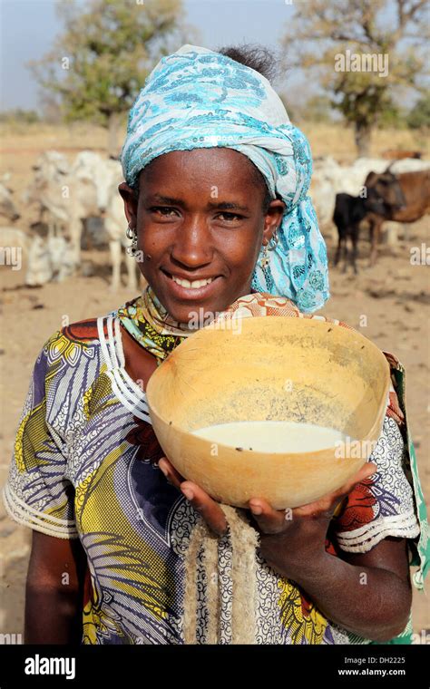 A Fulani Woman Presenting Calabash With Fresh Milk Burkina Faso Stock