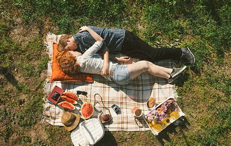 Couple Napping On A Picnic By Lumina Stocksy United