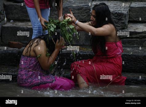 kathmandu nepal 6th sep 2016 nepalese hindu women perform a ritual bath during rishi