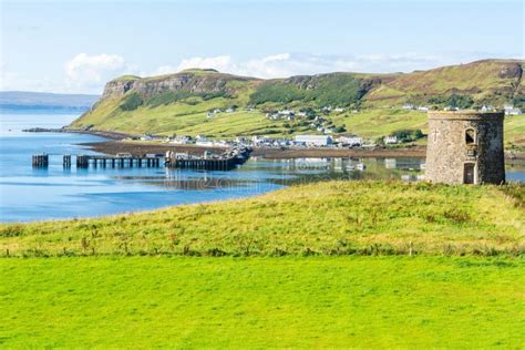 Uig Harbour Pier And Tower In The Isle Of Skye In Scotland Stock Photo