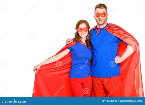 Happy Couple Of Superheroes Standing Together And Smiling At Camera