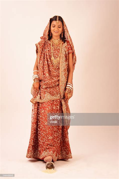 Newlywed Indian Bride Kicking The Kalash Photo Getty Images