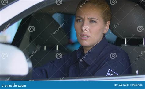 Tired Female Cop Taking Off Glasses Sitting In Car Bored Exhausted On Patrol Stock Video