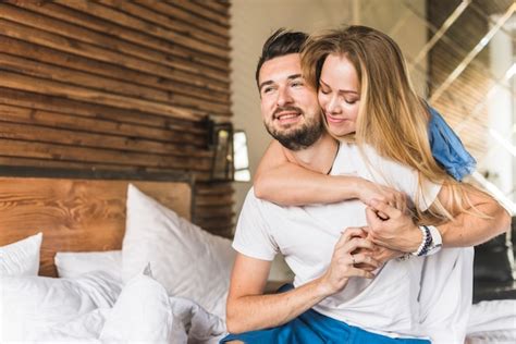 Free Photo Woman Embracing Man On Bed