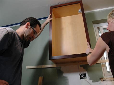 But before you can remove the sink, you first have to disconnect the sink look inside the cabinet and identify any screws that are connecting it to any other cabinets, the wall or the countertop. Kitchen Catch-Up: How to Install Cabinets | how-tos | DIY