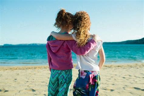 Image Of Two Girls Hugging At The Beach Austockphoto