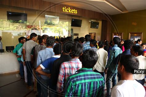 Image Of Crowd Of People In Queue Lines At Ticket Counter In A Theater