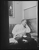 Alfred MacMillan, Pullman porter resting in the men's washroom aboard ...